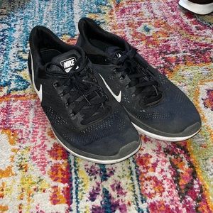 Black Nike shoes, size 10.5 in men’s.